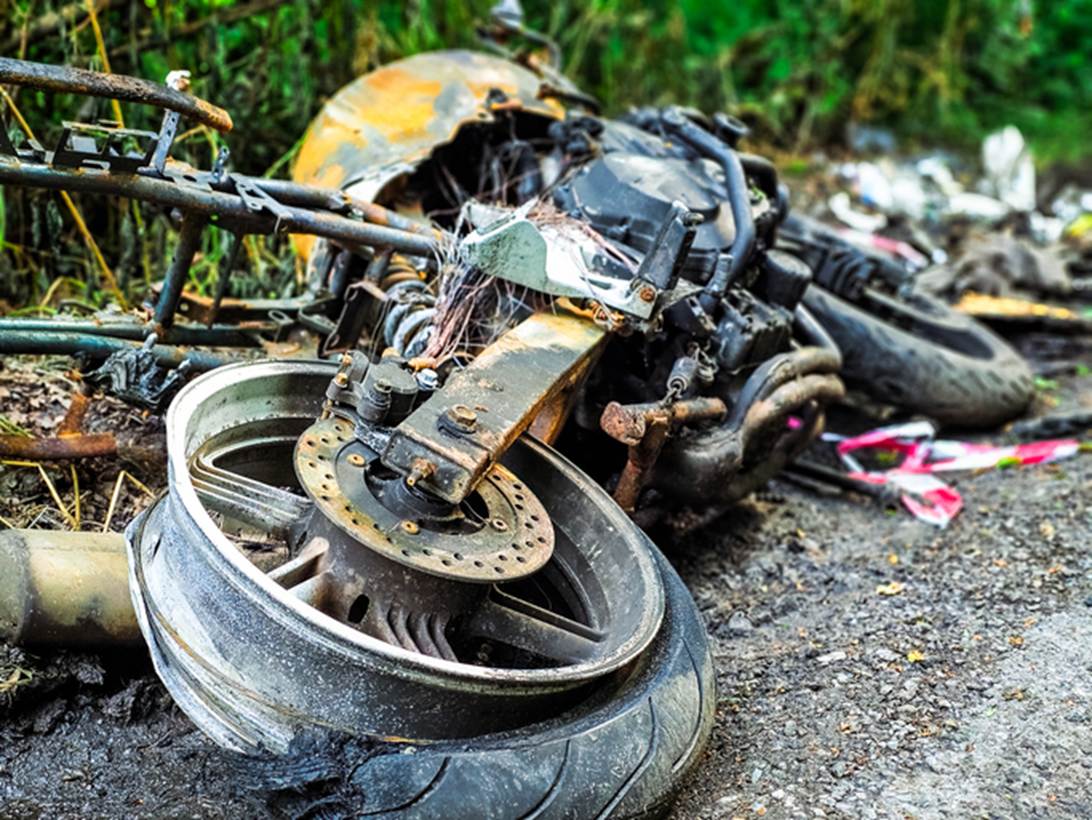 A wrecked motorcycle on the ground
AI-generated content may be incorrect.